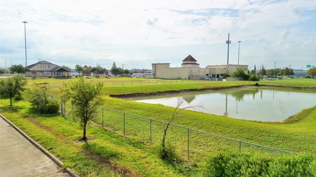 a view of a lake with a building in the background