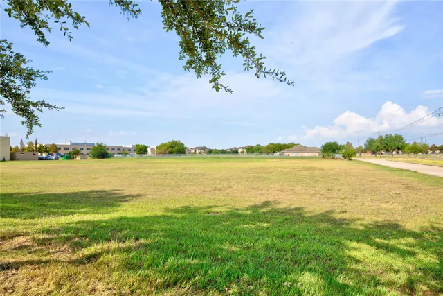 a view of a street with a building in the background
