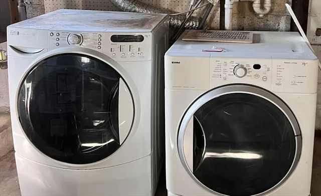 a utility room with dryer and washer