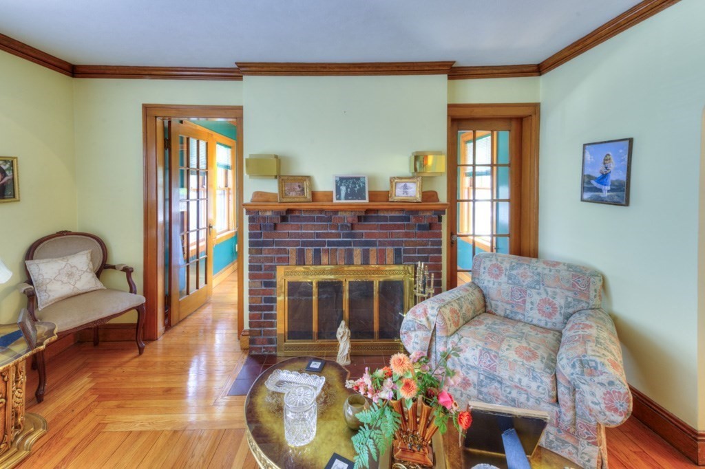 3 Longfellow Road Worcester, MA 01602 - Photo 11 of 33 a living room with furniture and a fireplace