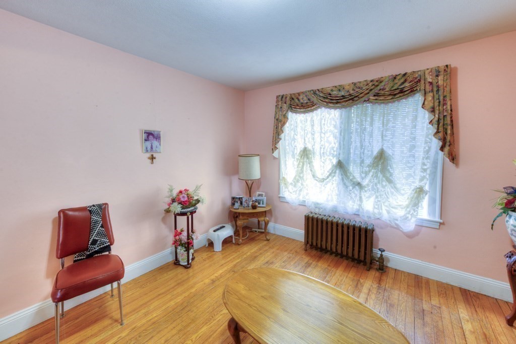 3 Longfellow Road Worcester, MA 01602 - Photo 29 of 33 a bedroom with furniture and a wooden floor