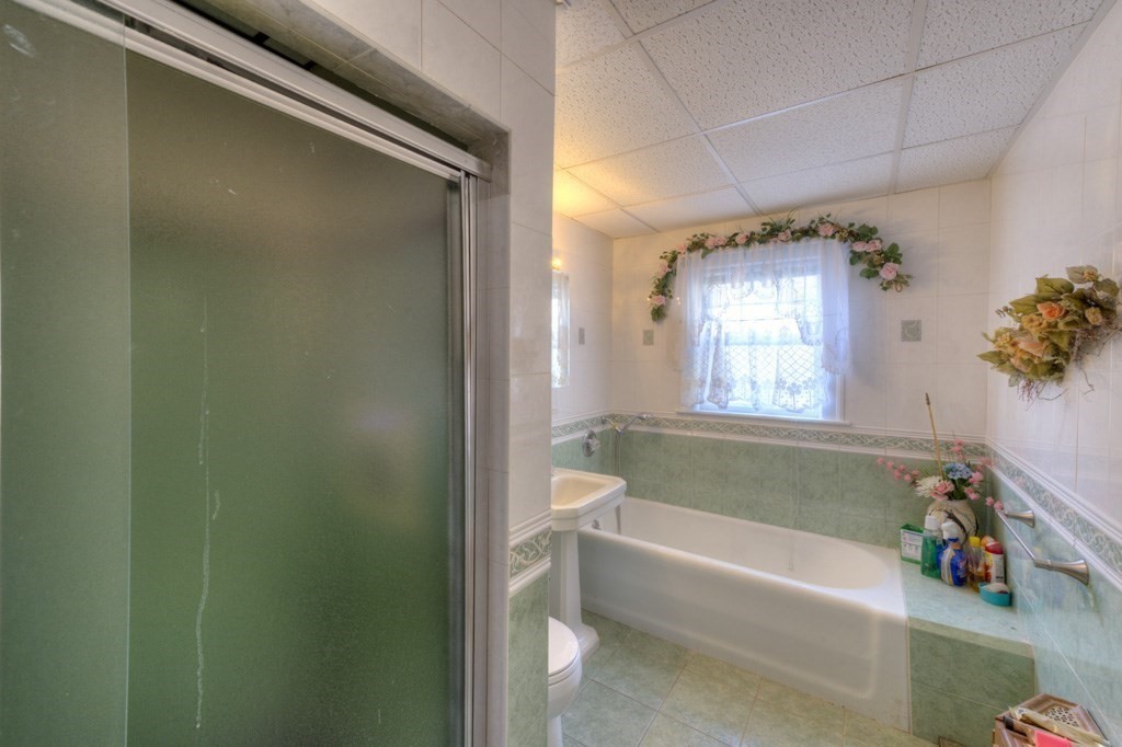 3 Longfellow Road Worcester, MA 01602 - Photo 32 of 33 a bathroom with a bathtub a window and a shower