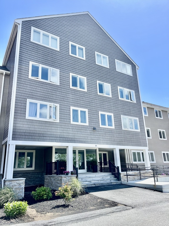 38 Dunham Road, Unit 303 Beverly, MA 01915 - Photo 1 of 12 a front view of a building