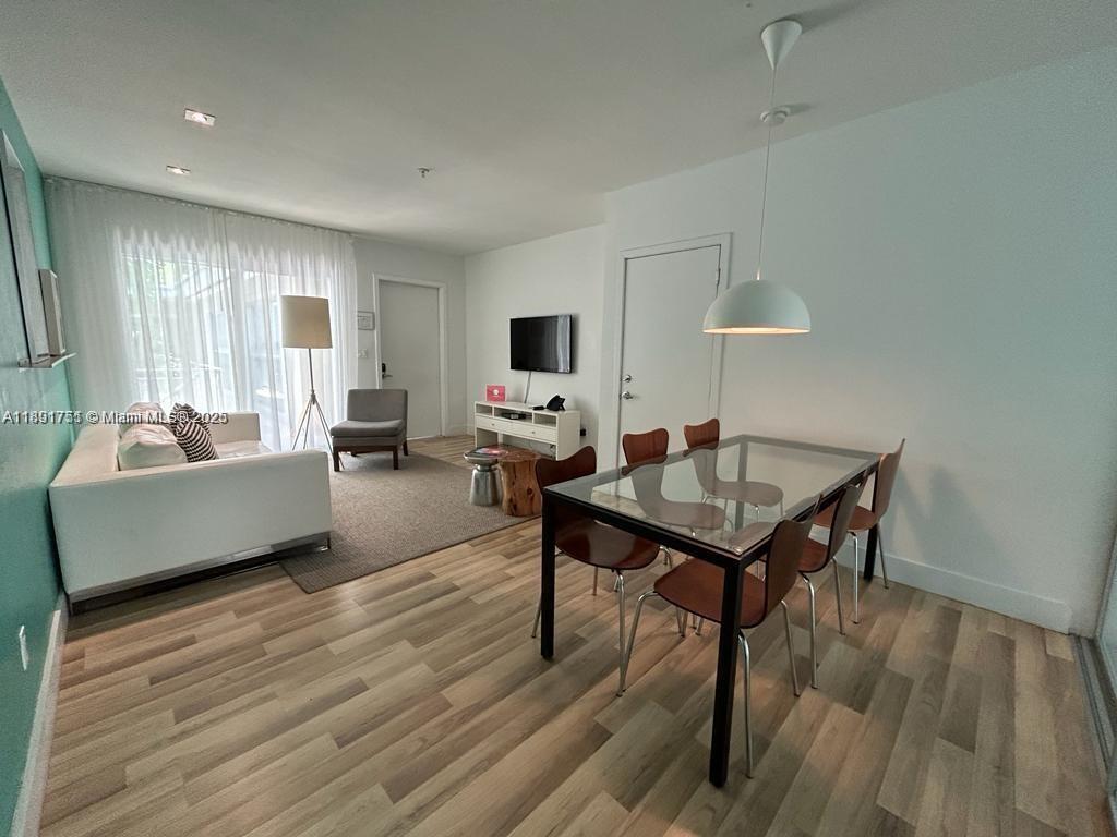 1816 Meridian Avenue, Unit 18 Miami Beach, FL 33139 - Photo 6 of 19 a living room with furniture and a wooden floor