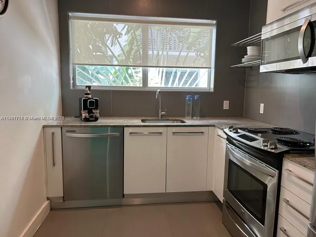 a kitchen with a stove and a microwave