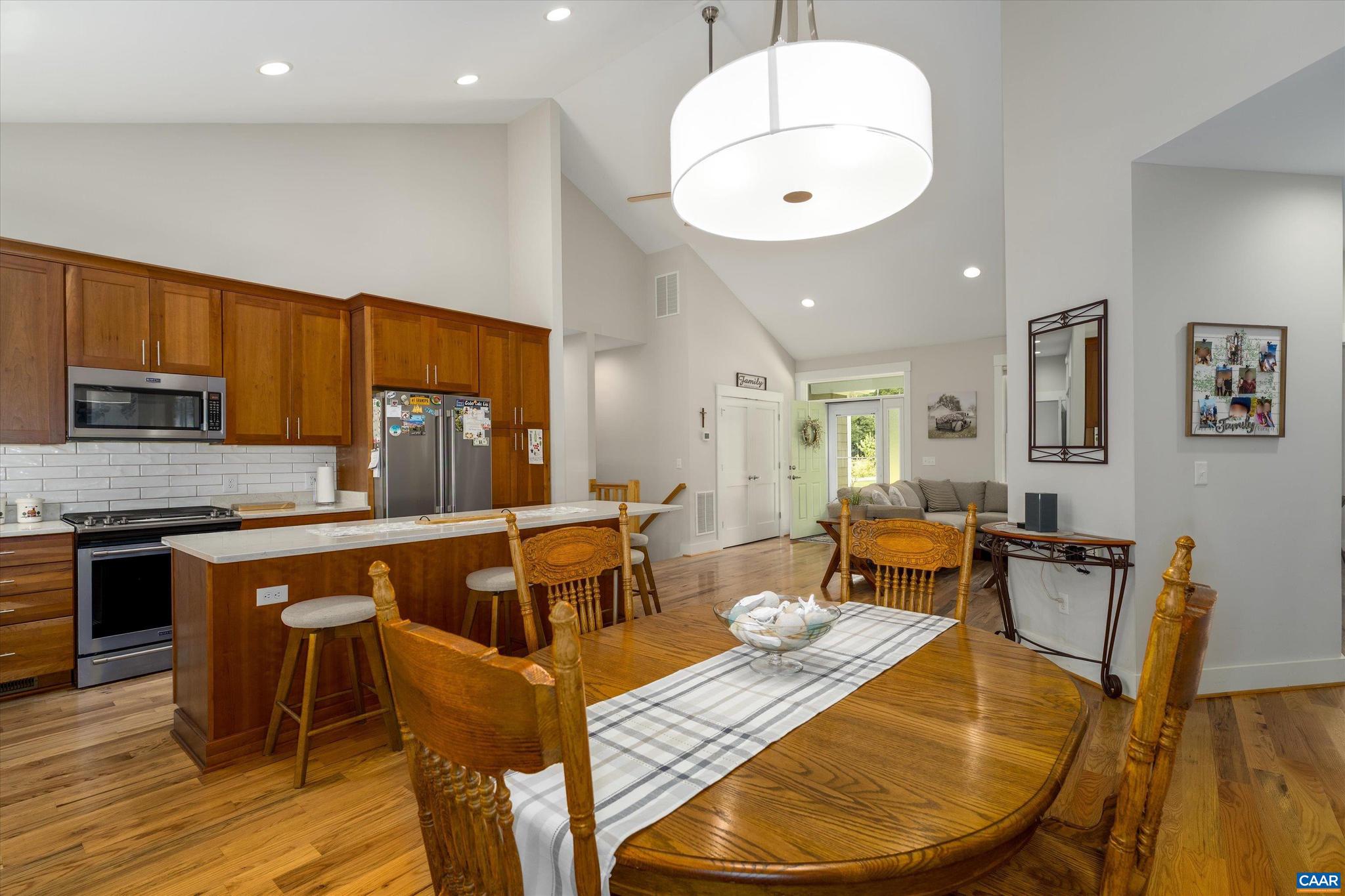 336 Bear Run Road Stanardsville, VA 22973 - Photo 14 of 67 a kitchen with stainless steel appliances granite countertop a table and chairs in it