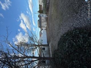 733 East Walnut Street, Unit UPPR Long Beach, NY 11561 - Photo 20 of 26 a view of a backyard with large trees