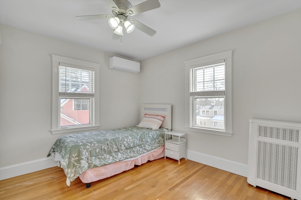 10 Dexter Road Lexington, MA 02420 - Photo 24 of 35 a bedroom with a large bed and a window
