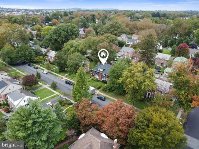 an aerial view of a forest with houses