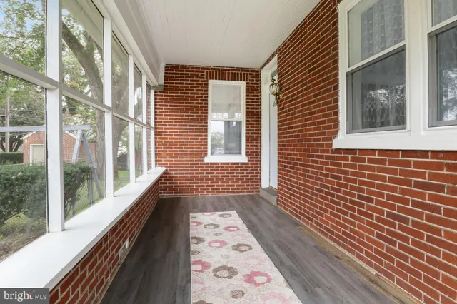 a view of a brick house with a large window