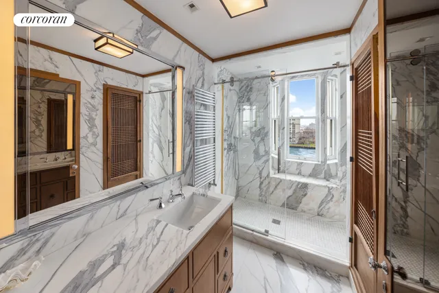 a spacious bedroom with a bed and large mirror