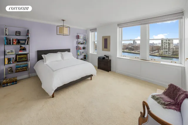 a en suite bathroom with a granite countertop sink and a large mirror