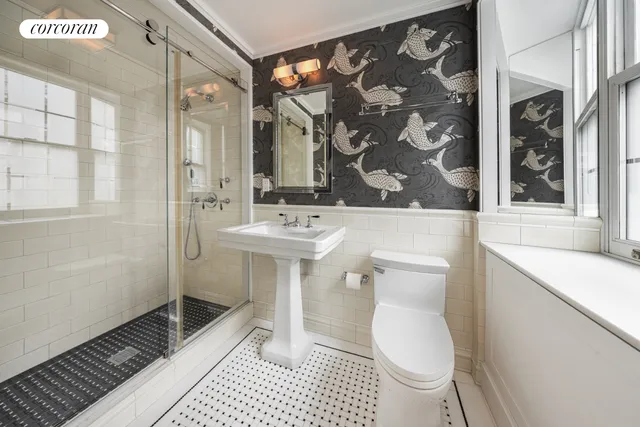 a spacious bedroom with a bed and a large window