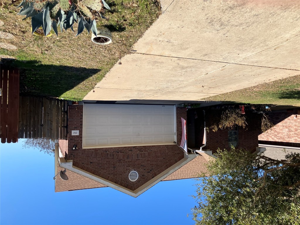 250 Engineers Pass Jarrell, TX 76537 - Photo 2 of 22 a front view of a house with a yard