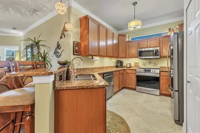 a view of a dining room with furniture and a chandelier