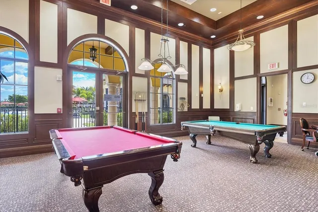 a view of a lake with boats and trees in the background