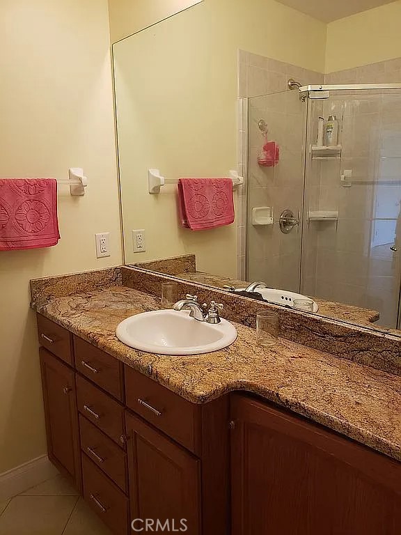 1360 South Waterview Drive Inverness, FL 34450 - Photo 14 of 34 a bathroom with a granite countertop sink and a mirror