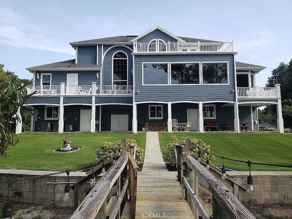 1360 South Waterview Drive Inverness, FL 34450 - Photo 2 of 34 a front view of a house with a yard