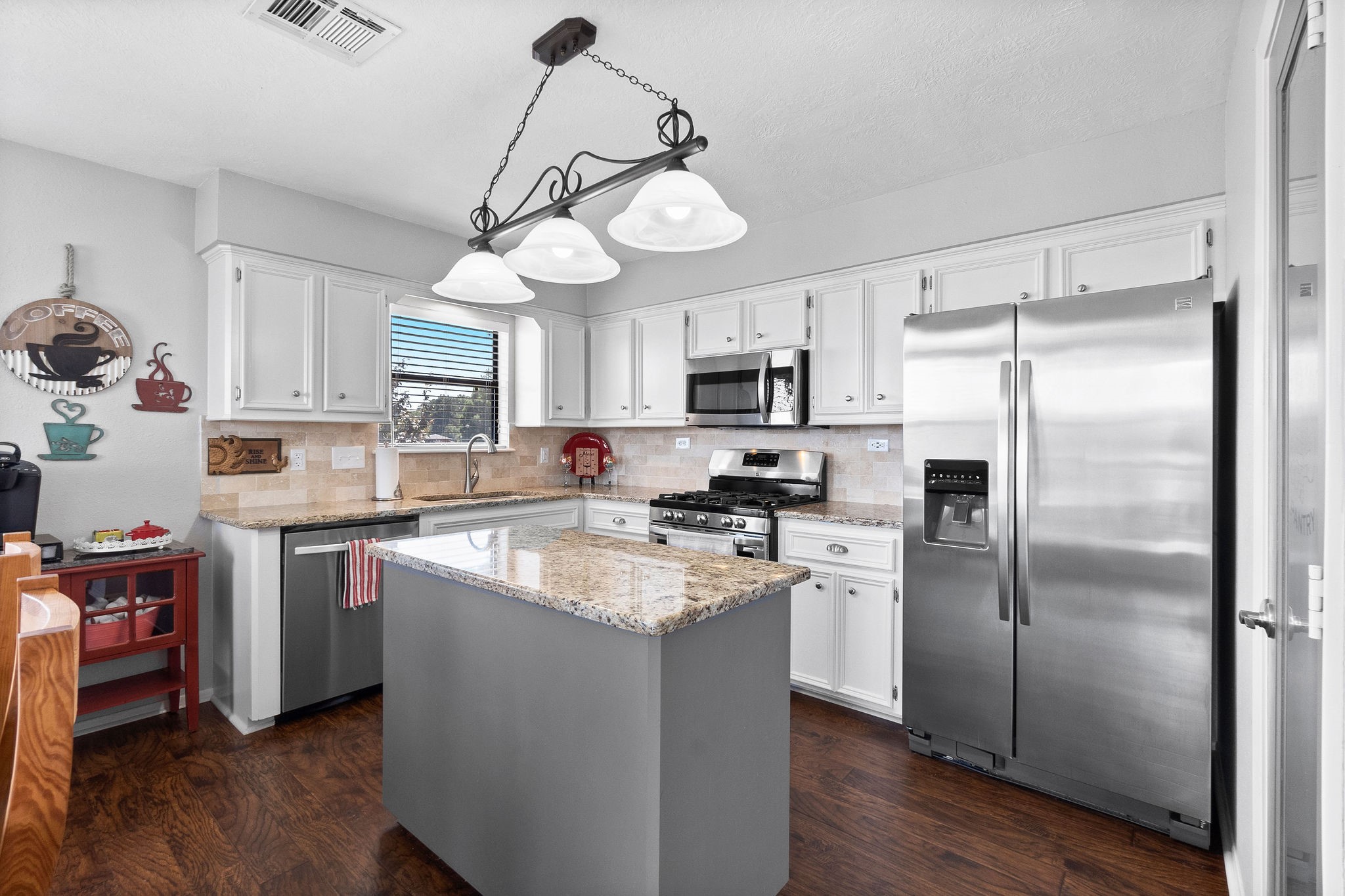 154 Point Drive Onalaska, TX 77360 - Photo 17 of 46 a kitchen with stainless steel appliances granite countertop a refrigerator a stove a microwave oven a sink dishwasher and a refrigerator with wooden floor