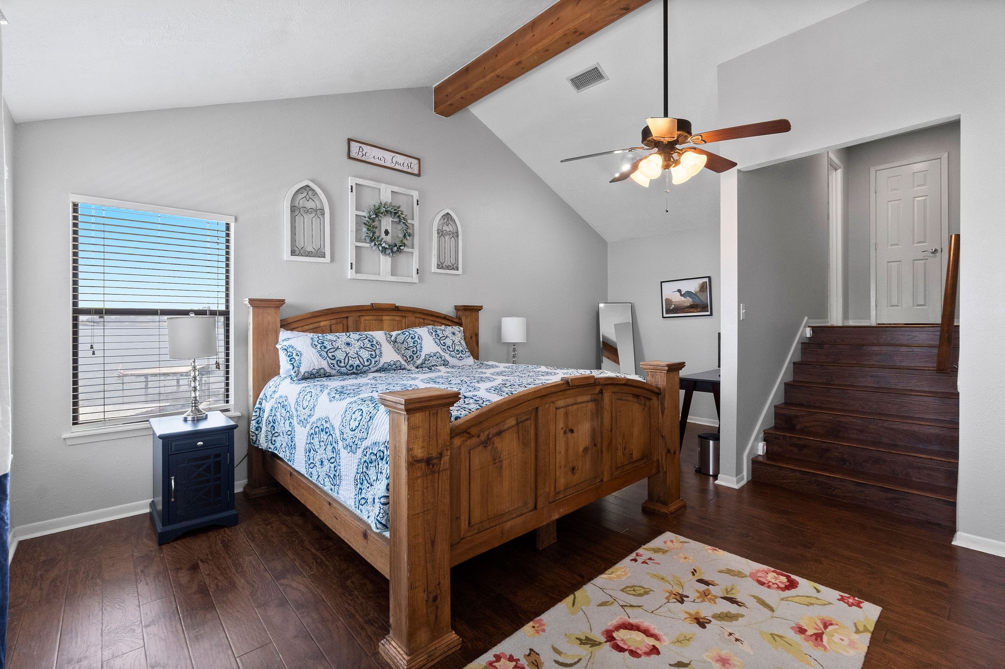154 Point Drive Onalaska, TX 77360 - Photo 22 of 46 a bedroom with a bed chandelier and a window