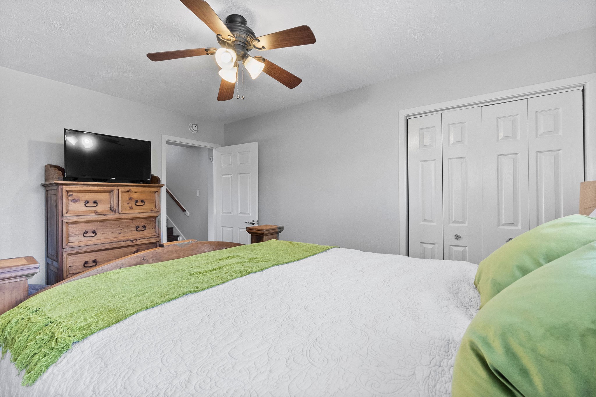154 Point Drive Onalaska, TX 77360 - Photo 27 of 46 a bedroom with a bed and a flat screen tv