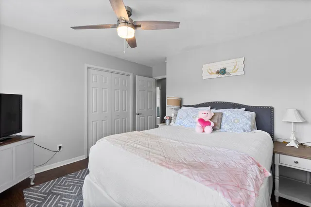 a bedroom with a large bed and a tv