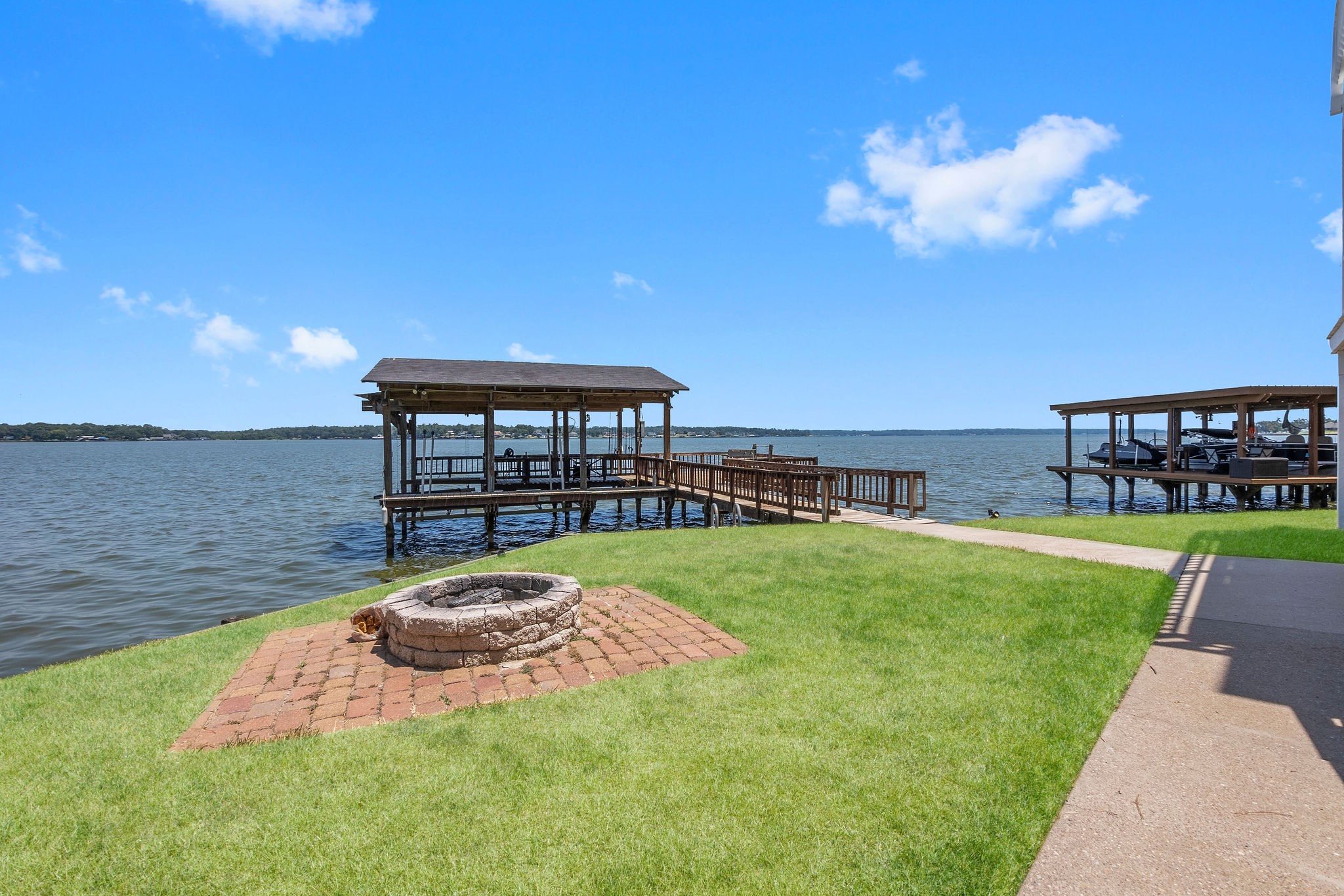 154 Point Drive Onalaska, TX 77360 - Photo 38 of 46 a view of a swimming pool with a yard