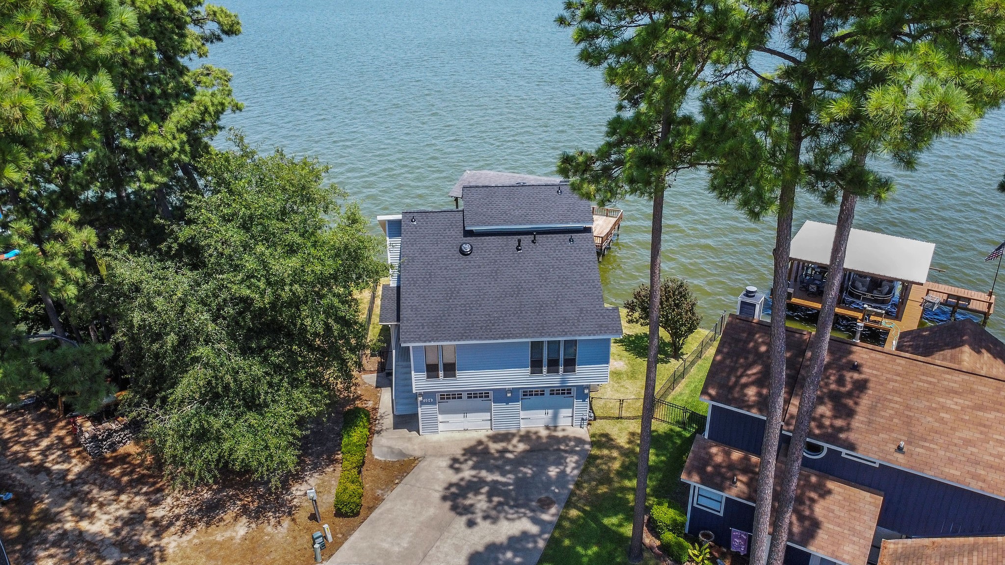 154 Point Drive Onalaska, TX 77360 - Photo 4 of 46 an aerial view of a house with a yard