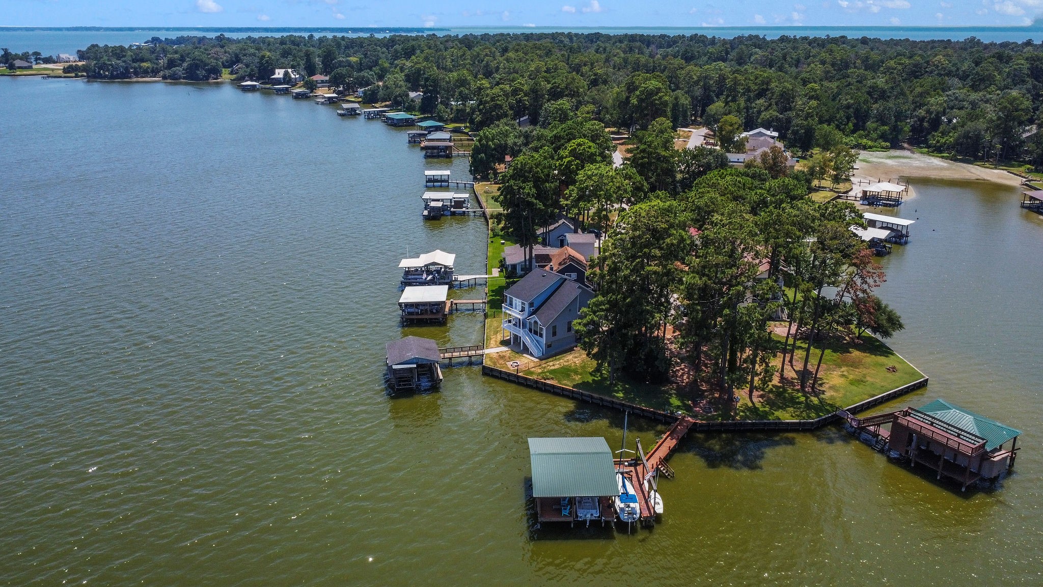 154 Point Drive Onalaska, TX 77360 - Photo 41 of 46 an aerial view of a house with a lake view