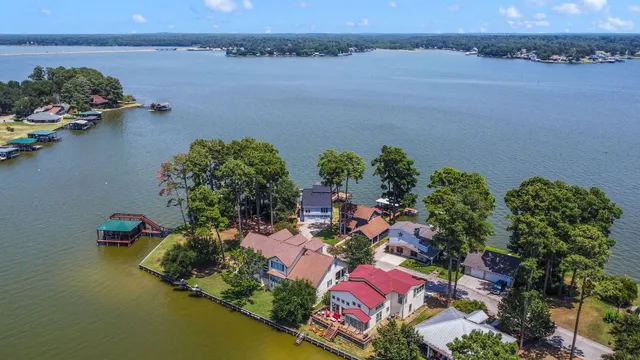 an aerial view of a house with a lake view