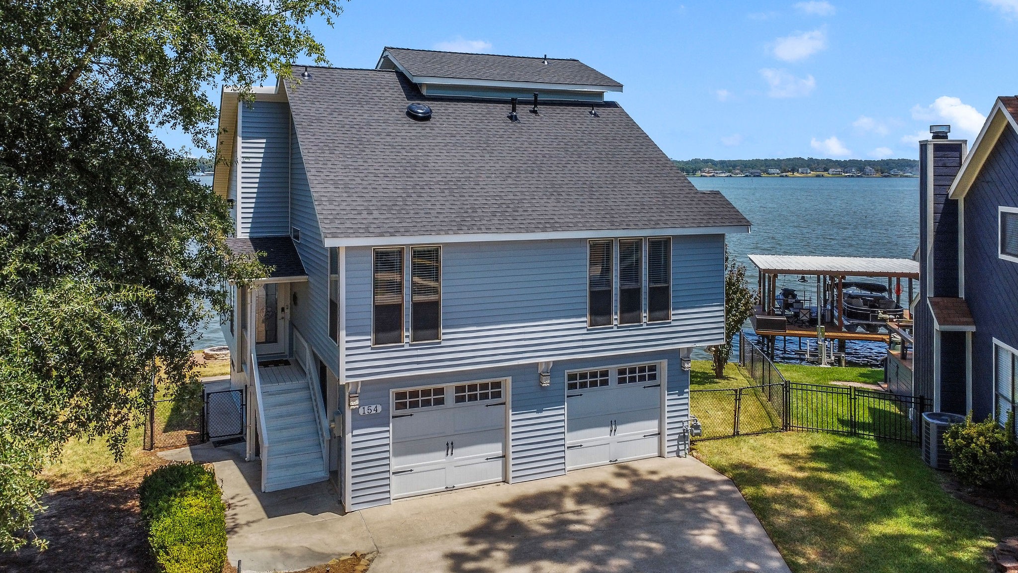 154 Point Drive Onalaska, TX 77360 - Photo 5 of 46 a house view with a outdoor space