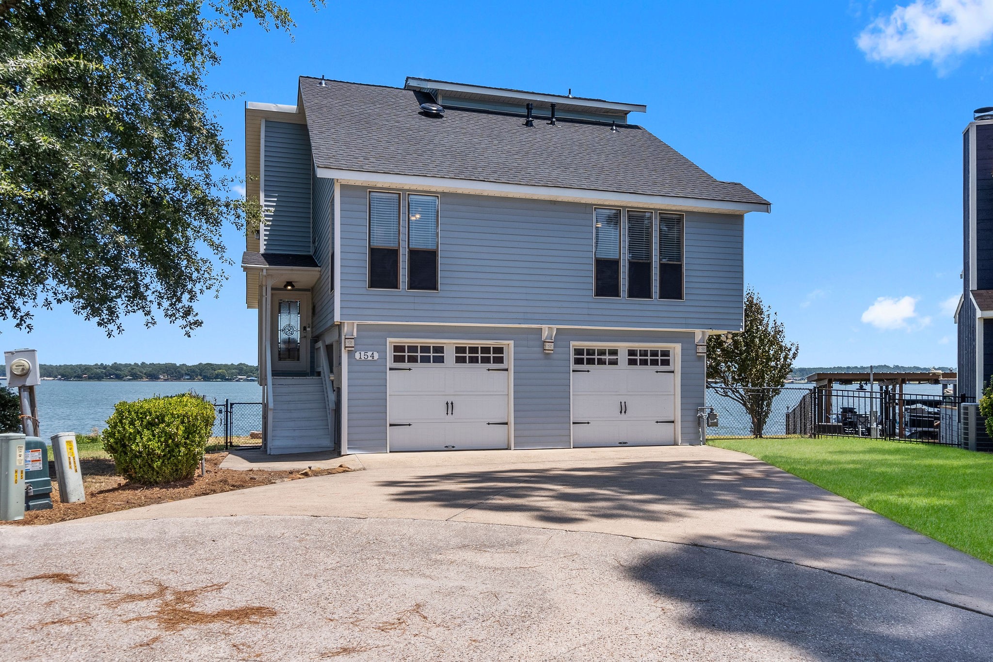 154 Point Drive Onalaska, TX 77360 - Photo 6 of 46 a view of a house with a yard