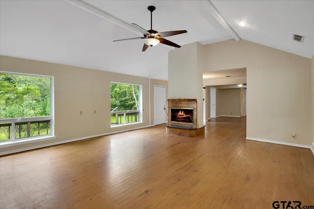 a view of livingroom with window fireplace and hardwood floor