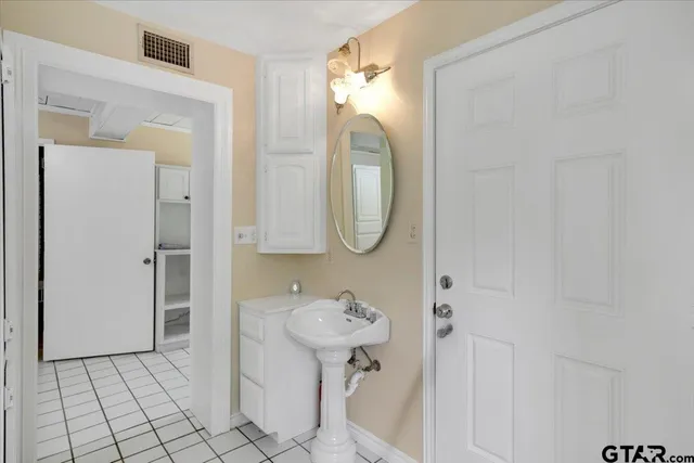 a bathroom with a sink a toilet and a shower