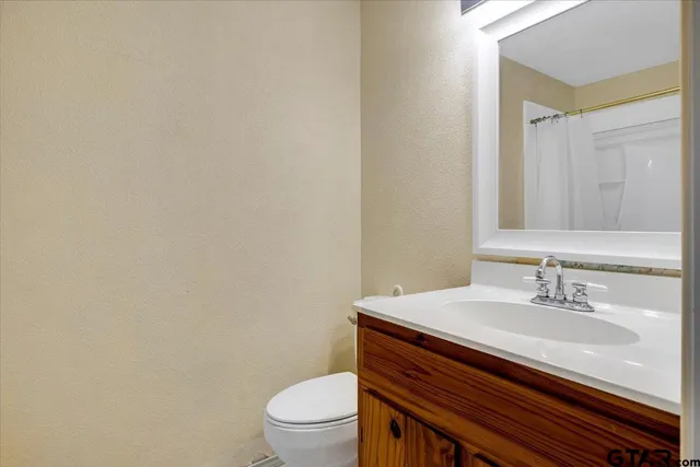 a bathroom with a shower and a bath tub