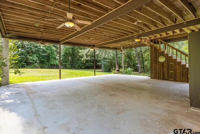 a view of a porch with wooden floor and outdoor space