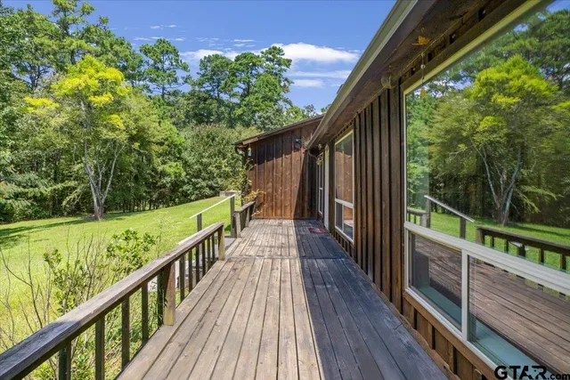 a view of empty room with wooden walls