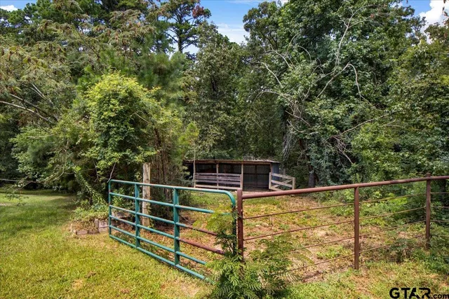 a front view of a house with a garden and porch