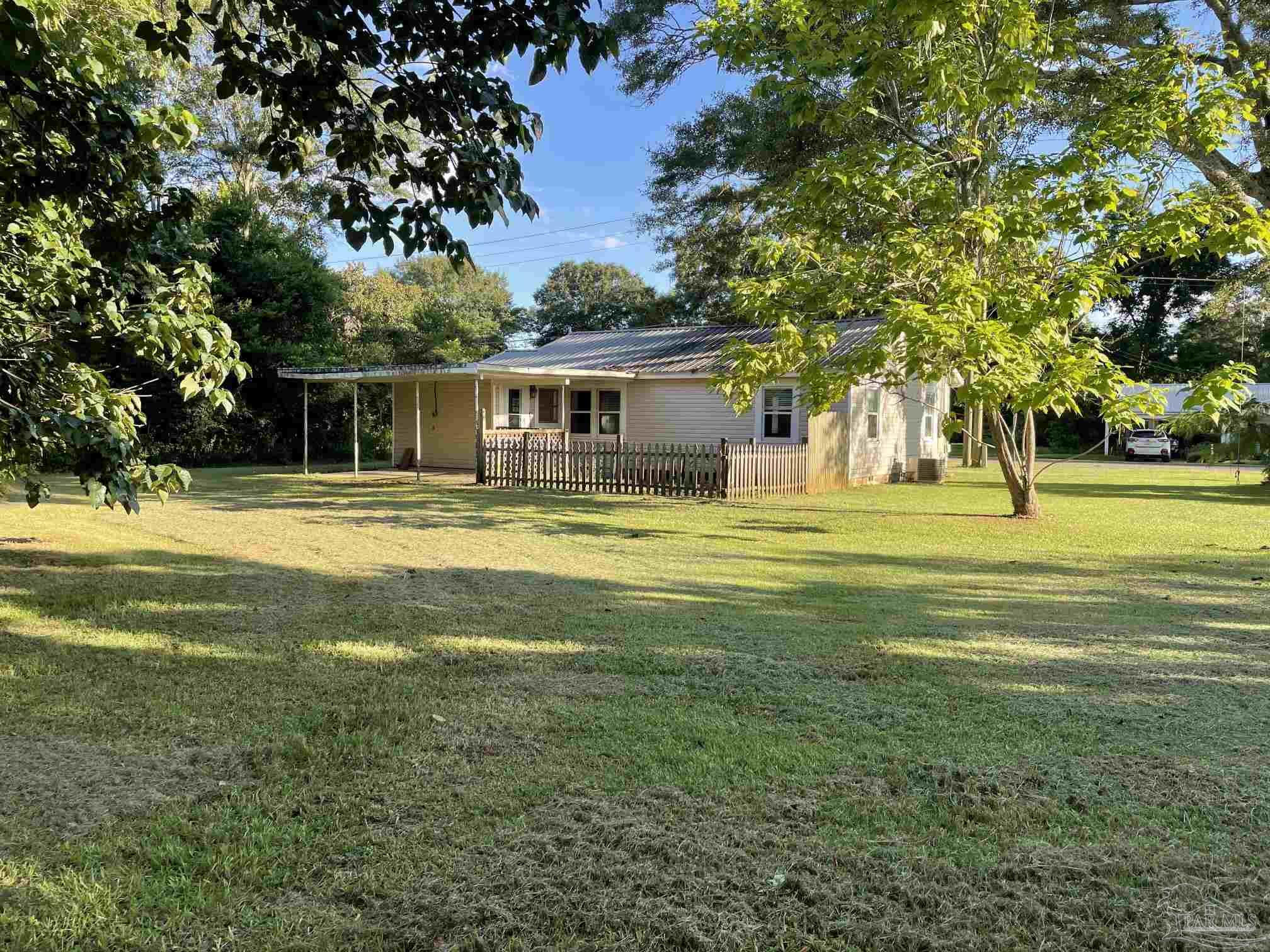3824 Williams Avenue Jay, FL 32565 - Photo 11 of 11 a front view of house with yard and trees