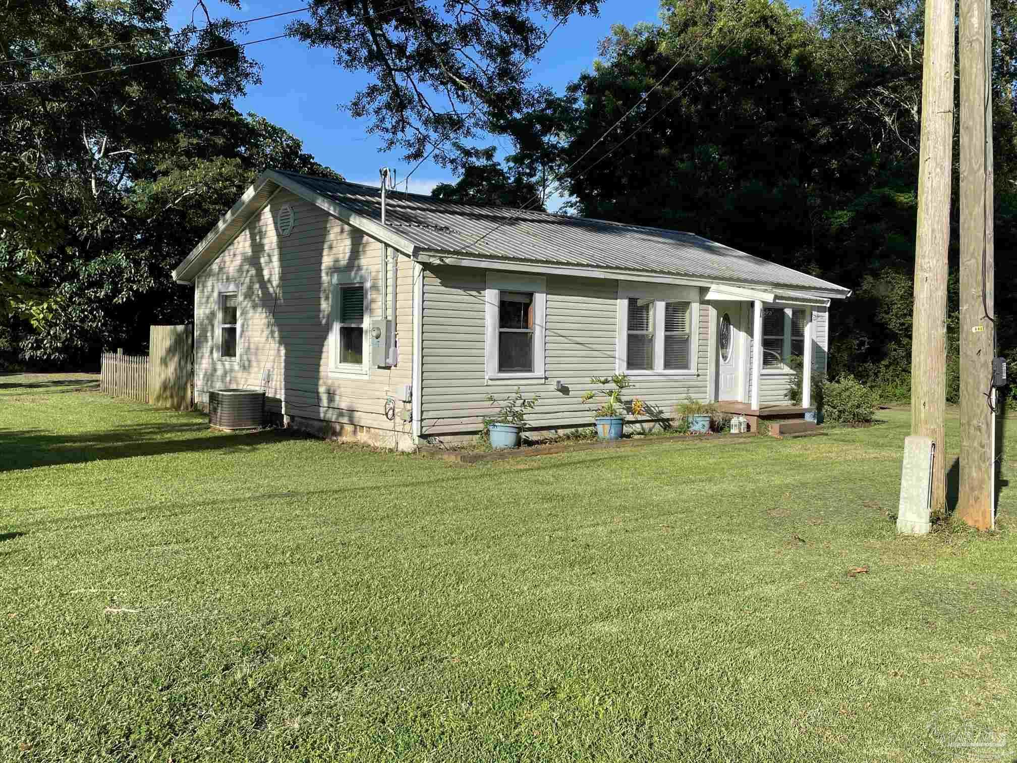 3824 Williams Avenue Jay, FL 32565 - Photo 5 of 11 a front view of house with yard and green space
