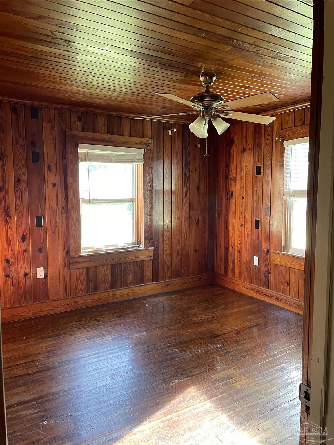 3824 Williams Avenue Jay, FL 32565 - Photo 7 of 11 a view of a livingroom with wooden floor and a ceiling fan