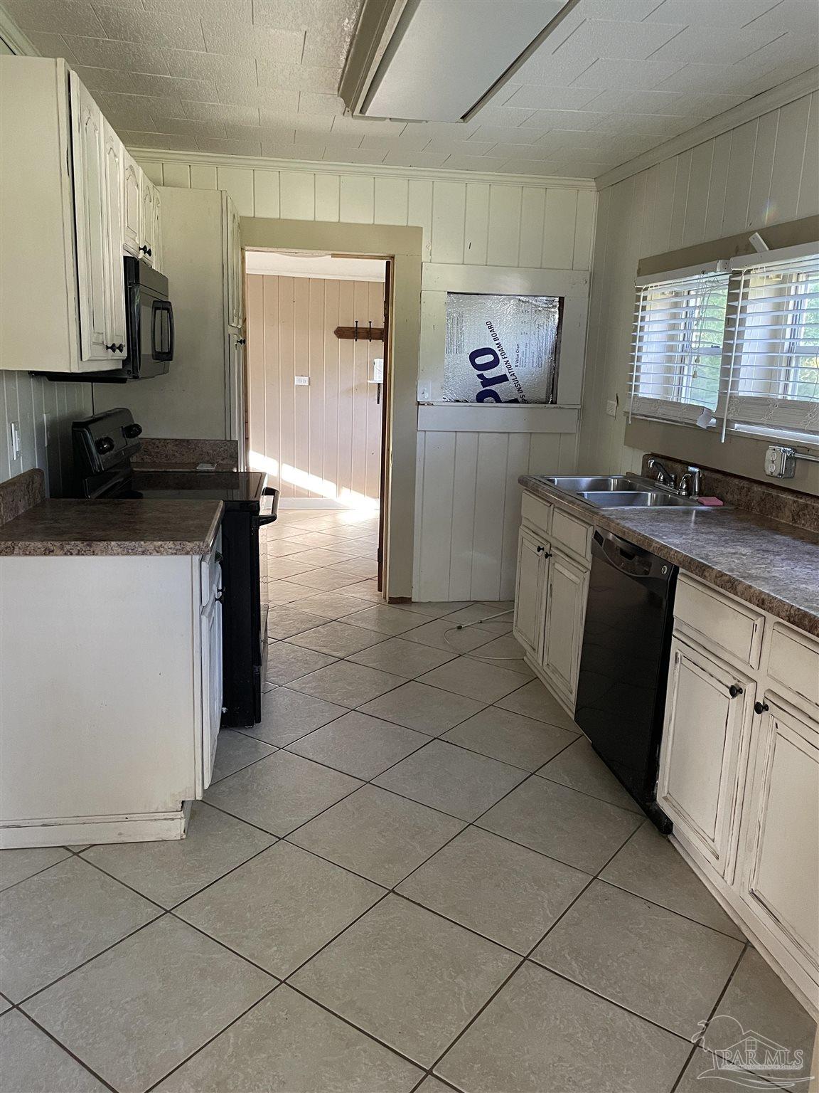 3824 Williams Avenue Jay, FL 32565 - Photo 9 of 11 a kitchen with stainless steel appliances granite countertop a sink and a stove