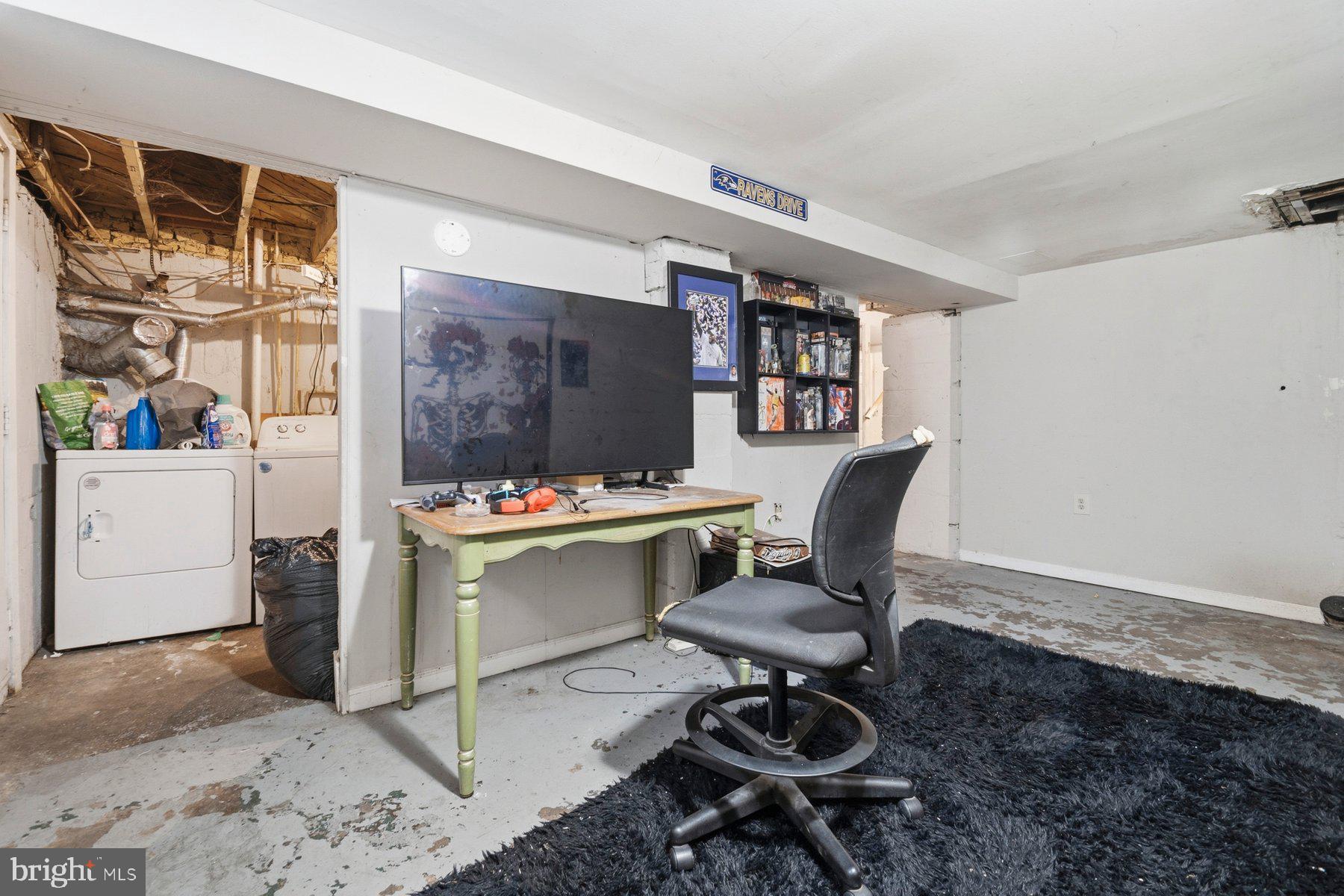 4931 Brookwood Road Baltimore, MD 21225 - Photo 21 of 25 a view of a workspace with furniture