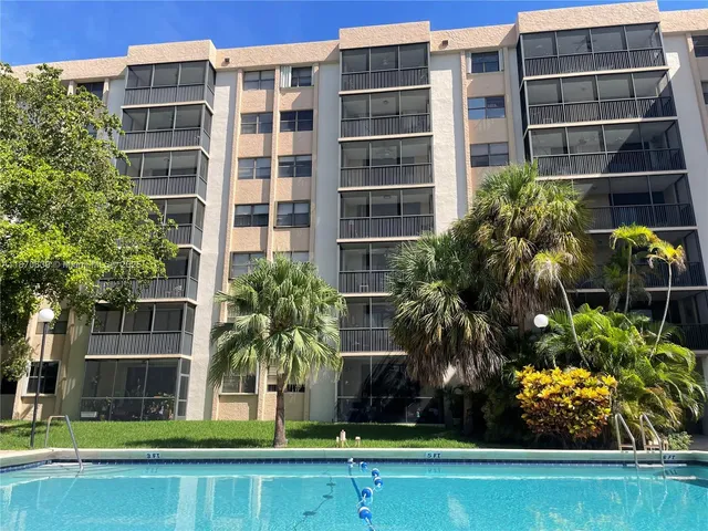 a front view of building with yard