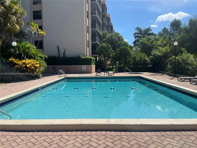 a view of swimming pool from a balcony