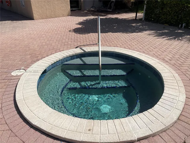 a view of a swimming pool with a sitting space