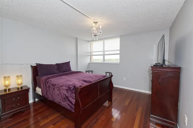 a bedroom with bed and window