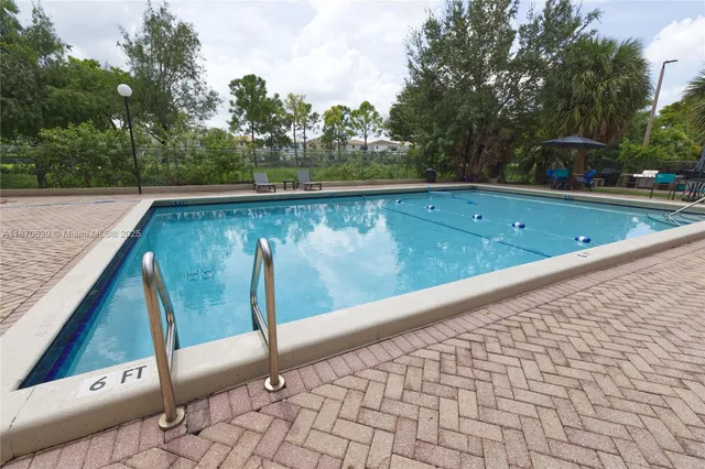 a view of swimming pool from a balcony