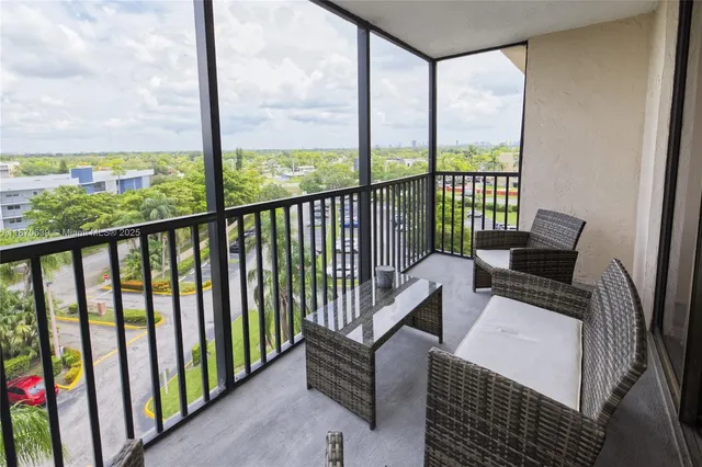 a view of balcony with furniture