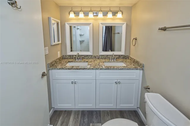 a bathroom with a shower and a toilet